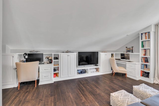 living room with lofted ceiling, built in desk, dark wood-style flooring, and built in shelves