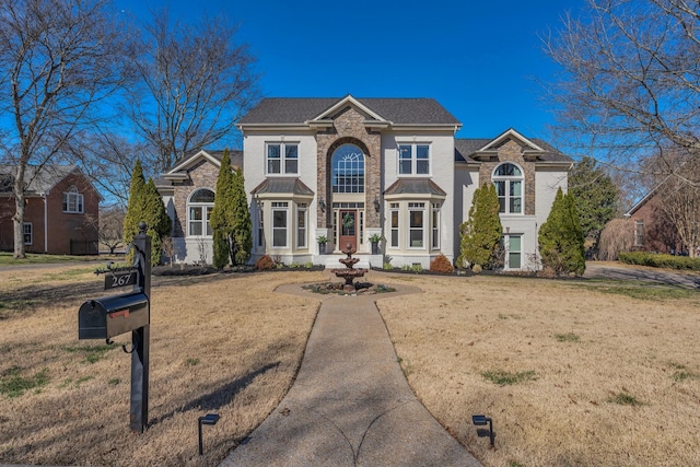 traditional-style house with a front yard