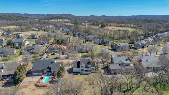 drone / aerial view featuring a mountain view and a residential view