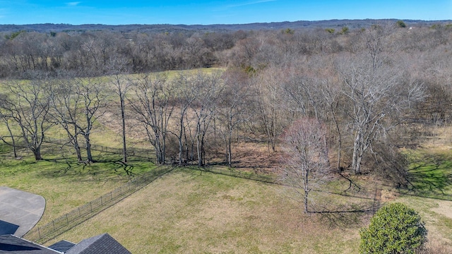 aerial view featuring a wooded view