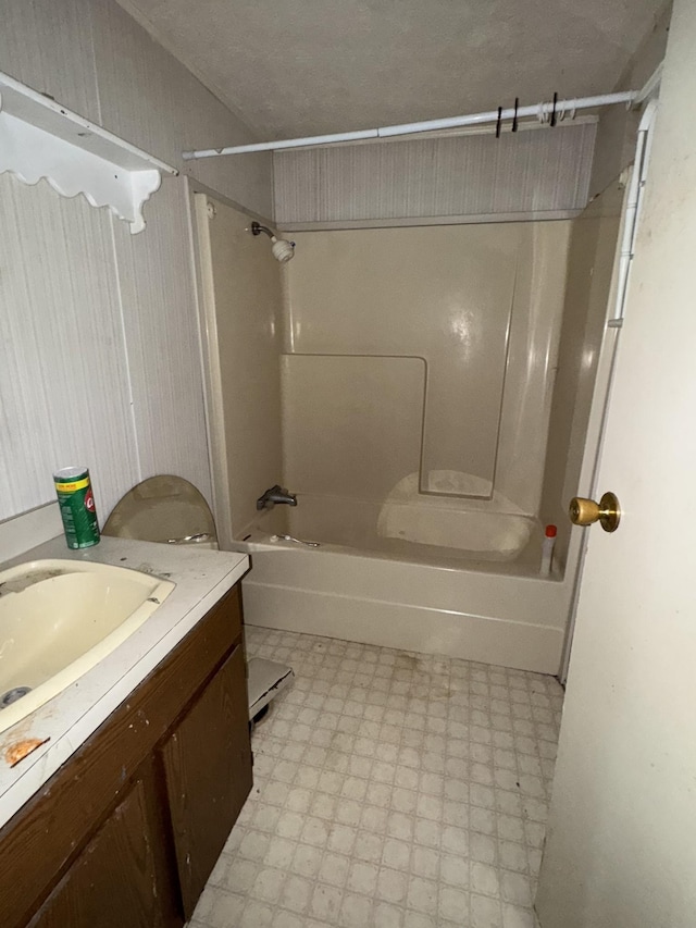 full bathroom featuring bathtub / shower combination, vanity, and tile patterned floors