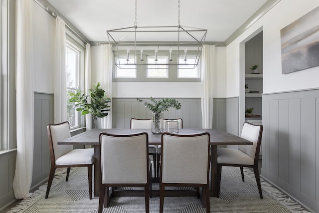 dining room featuring a wainscoted wall