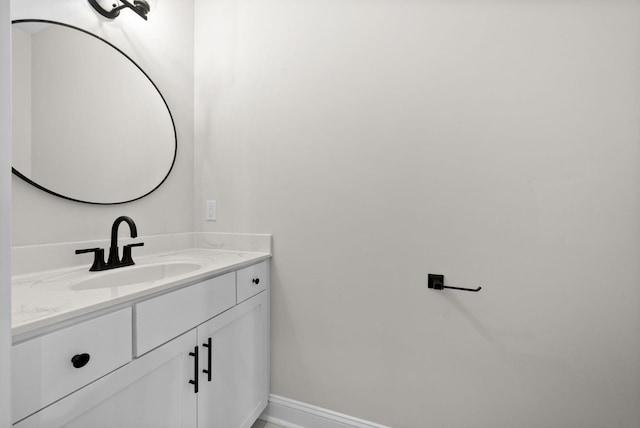 bathroom with vanity and baseboards