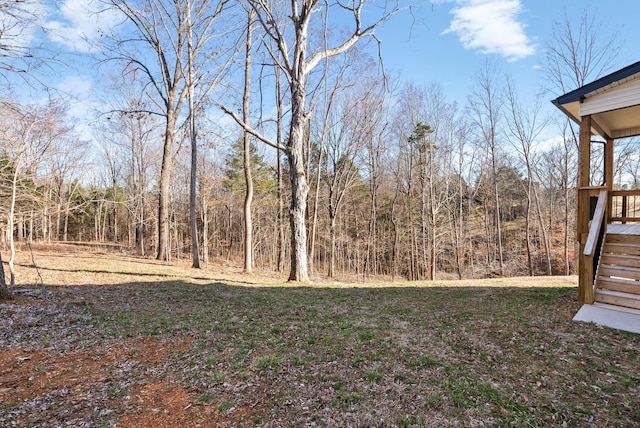 view of yard featuring a wooded view