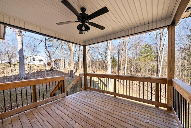 wooden deck featuring ceiling fan