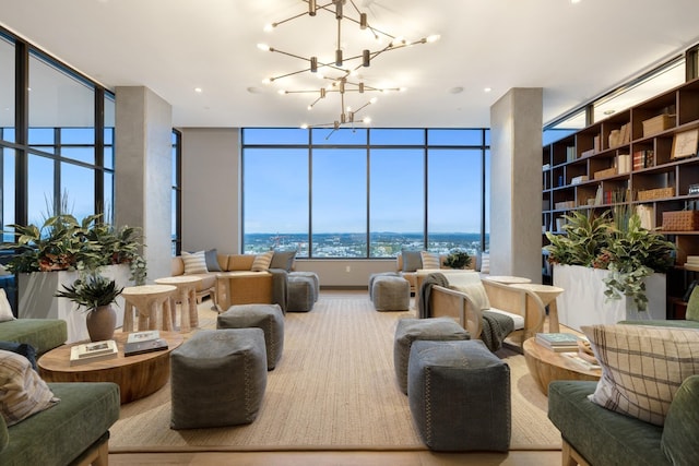 living area with a wall of windows and a notable chandelier