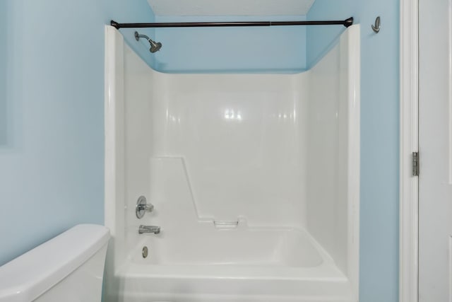 bathroom with shower / tub combination and toilet