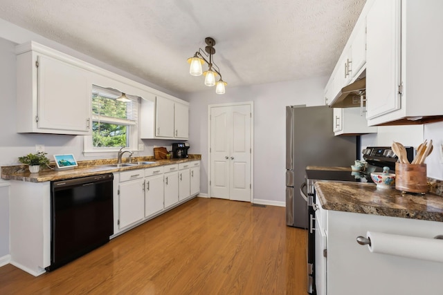 kitchen featuring appliances with stainless steel finishes, a sink, white cabinets, and under cabinet range hood