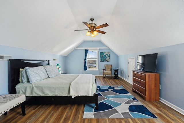 bedroom with visible vents, baseboards, ceiling fan, wood finished floors, and vaulted ceiling