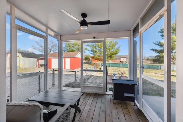 sunroom with a ceiling fan