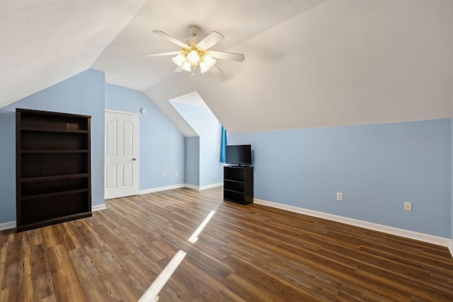 bonus room featuring a ceiling fan, lofted ceiling, baseboards, and wood finished floors