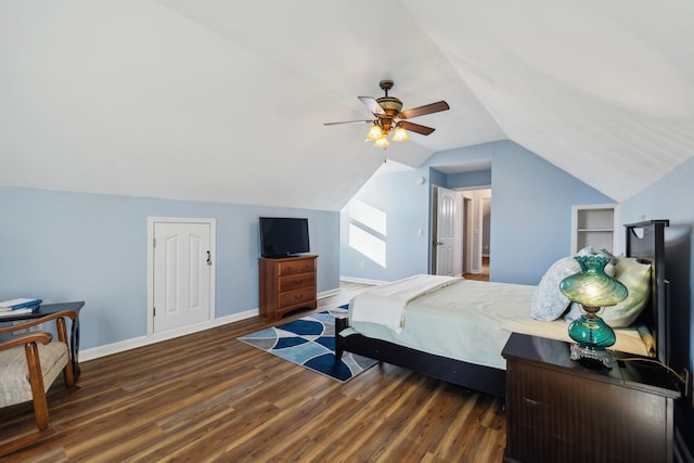 bedroom with vaulted ceiling, ceiling fan, wood finished floors, and baseboards