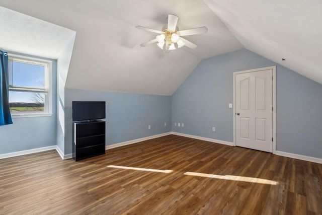 bonus room featuring lofted ceiling, ceiling fan, baseboards, and wood finished floors