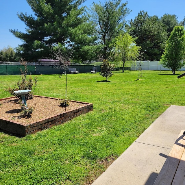 view of yard with a fenced backyard