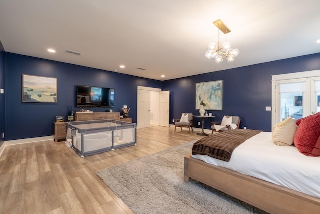 bedroom with baseboards, visible vents, an inviting chandelier, light wood-type flooring, and recessed lighting