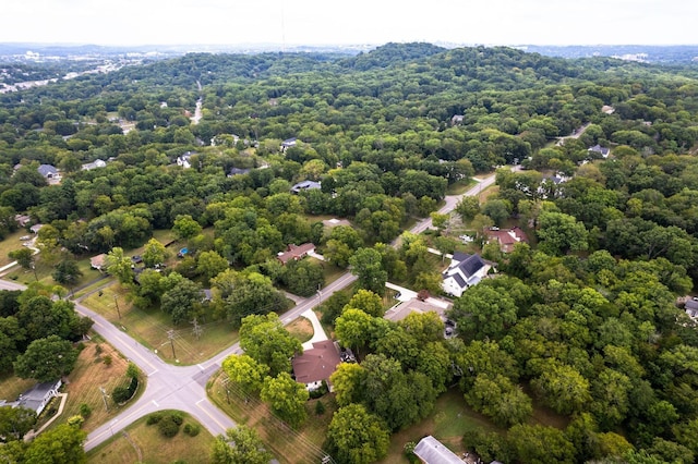 drone / aerial view featuring a view of trees