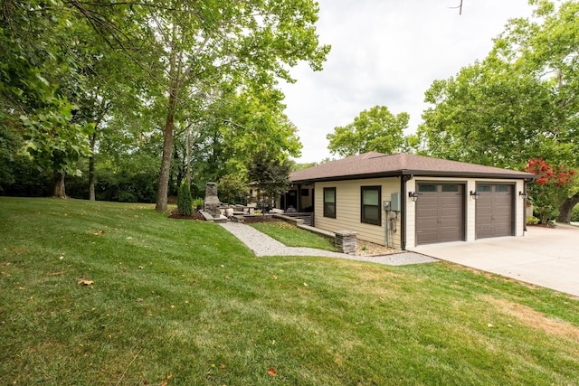 view of front of home featuring a garage and a front lawn