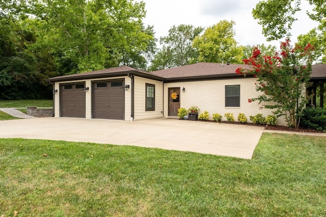 single story home with a front yard, concrete driveway, and brick siding