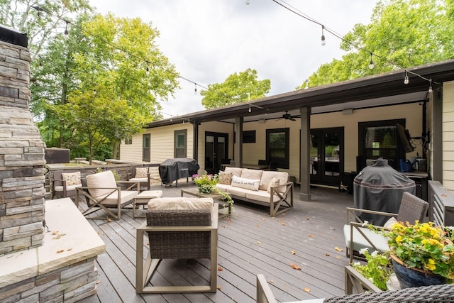 deck with ceiling fan, an outdoor hangout area, grilling area, and french doors