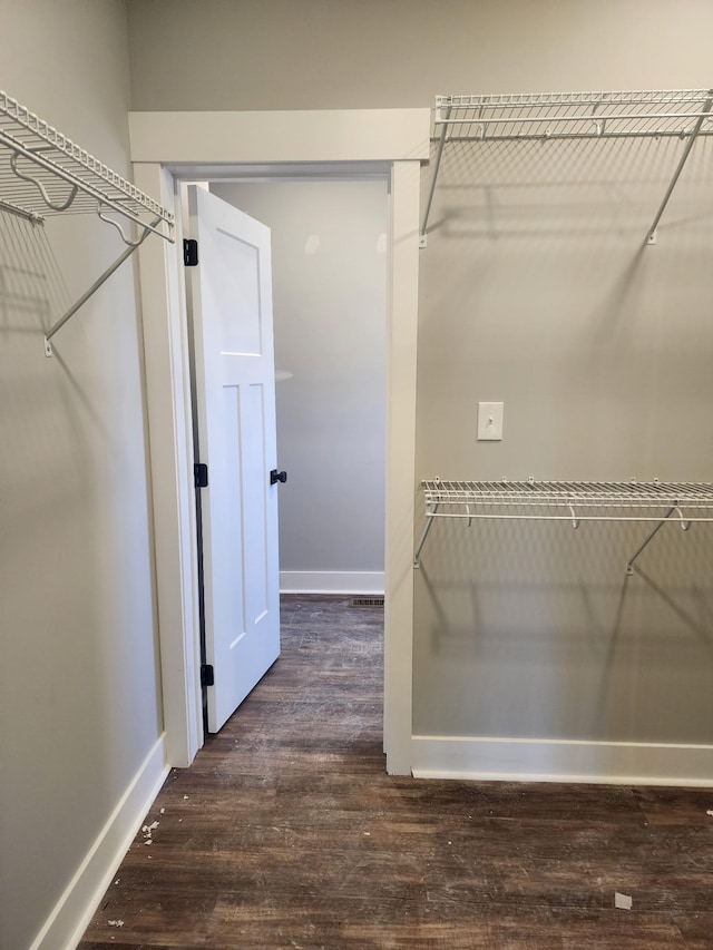 spacious closet with wood finished floors