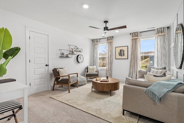 sitting room with carpet floors, recessed lighting, visible vents, and a ceiling fan