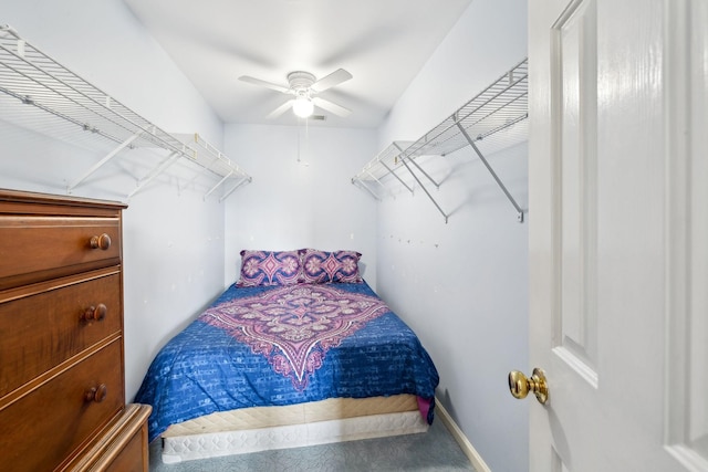 bedroom with a ceiling fan and baseboards