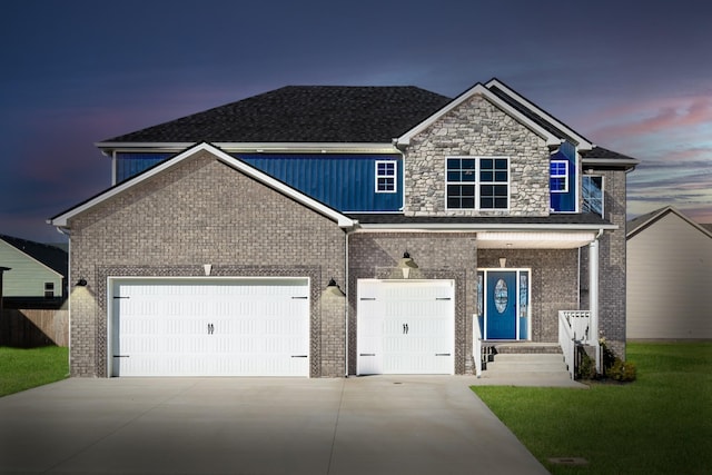 view of front facade featuring driveway, a front lawn, and brick siding