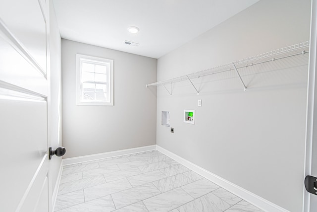 clothes washing area featuring washer hookup, marble finish floor, visible vents, laundry area, and baseboards