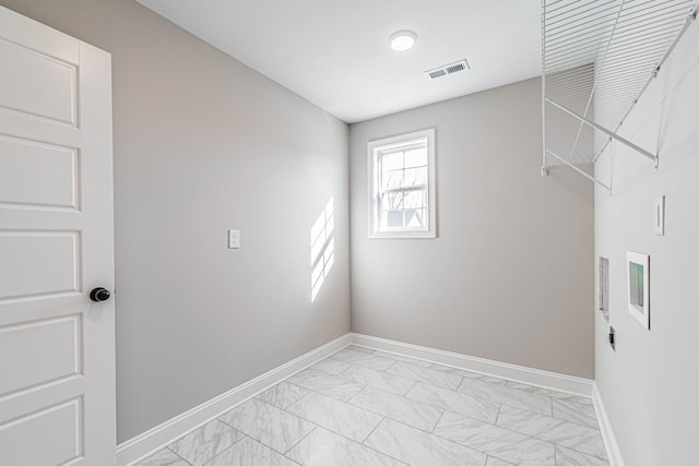 washroom with laundry area, marble finish floor, visible vents, and baseboards