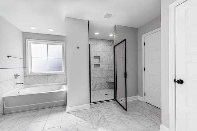 full bath featuring marble finish floor, visible vents, a shower stall, and a bath