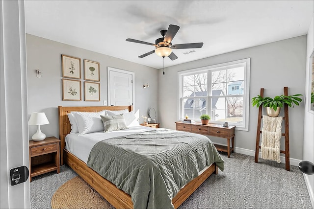 bedroom with light carpet, baseboards, visible vents, and a ceiling fan