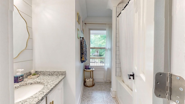 bathroom with vanity and baseboards