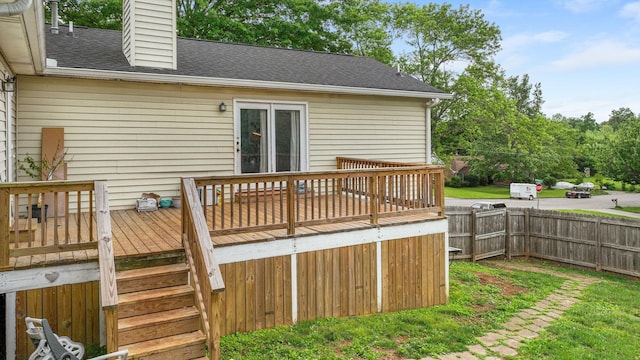 wooden terrace featuring fence