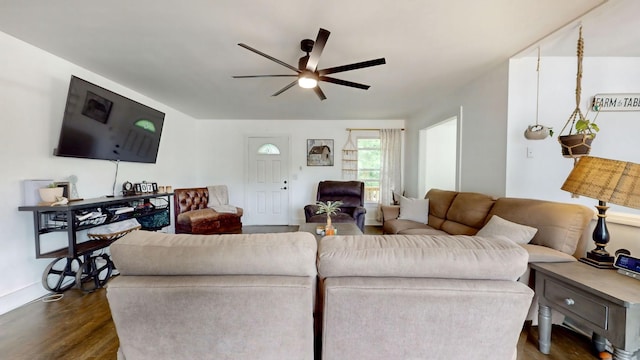 living area featuring dark wood-style floors and a ceiling fan