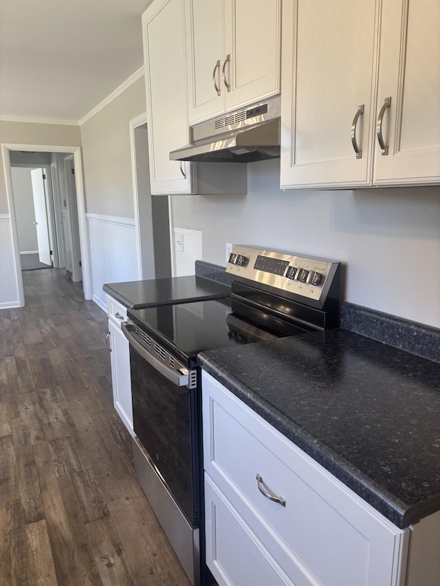 kitchen with ornamental molding, white cabinetry, stainless steel electric range oven, and under cabinet range hood