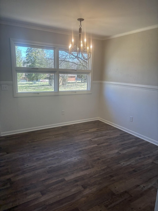 unfurnished dining area featuring ornamental molding, dark wood-style flooring, and a healthy amount of sunlight