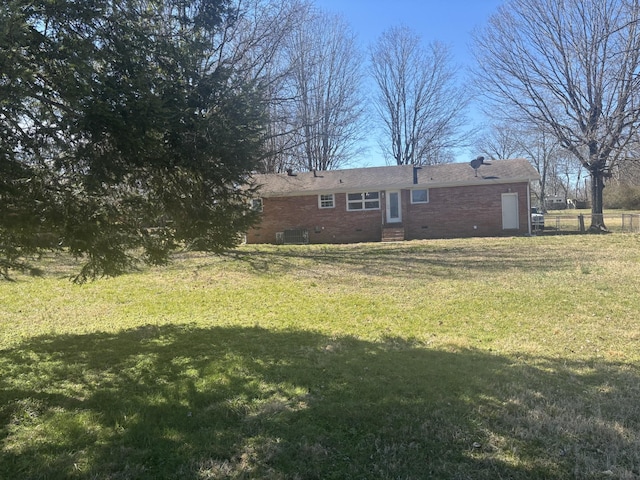 view of yard with fence and central air condition unit