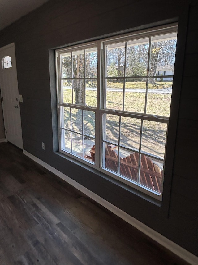 details with wood finished floors and baseboards