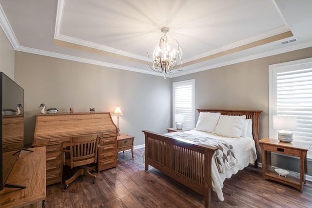 bedroom featuring a tray ceiling, crown molding, a notable chandelier, visible vents, and wood finished floors