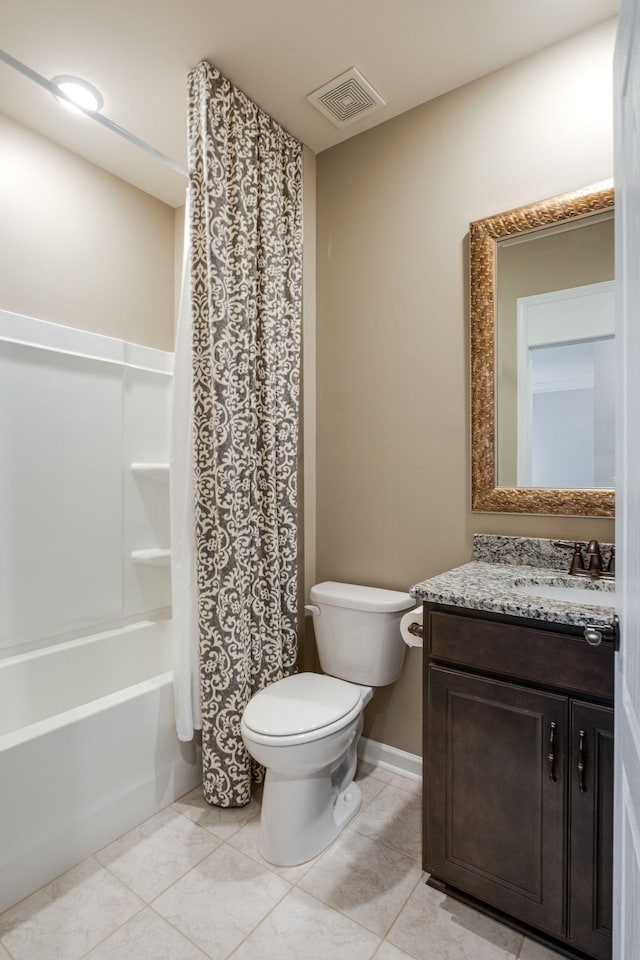 bathroom with visible vents, toilet, vanity, tile patterned flooring, and baseboards