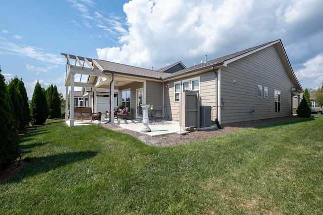 back of property with a yard, cooling unit, and a patio