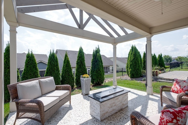 view of patio with a gazebo, outdoor lounge area, and fence