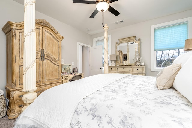 bedroom with ceiling fan and visible vents