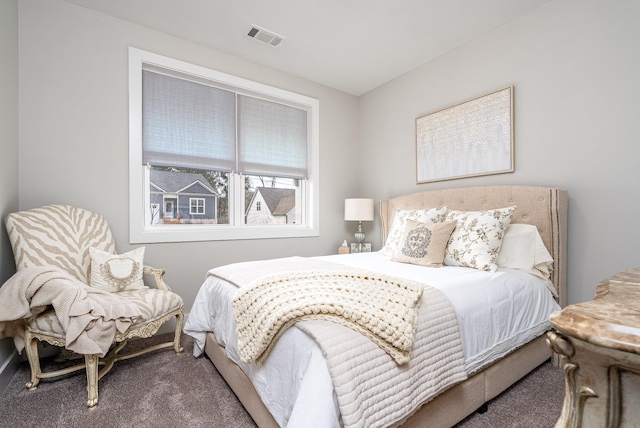 bedroom with visible vents and carpet floors