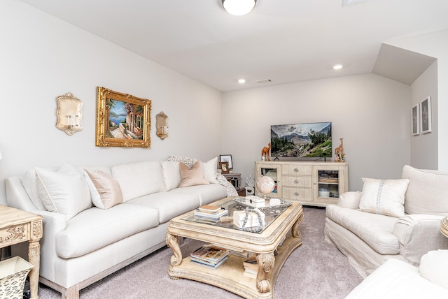 carpeted living room with visible vents and recessed lighting