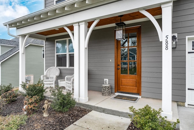 property entrance featuring covered porch