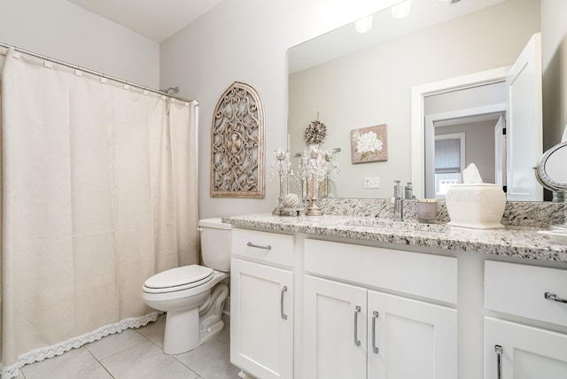 full bathroom featuring tile patterned floors, vanity, and toilet