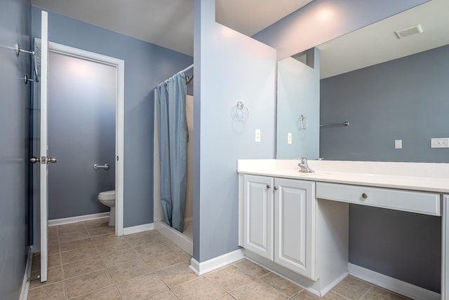 bathroom featuring visible vents, baseboards, toilet, vanity, and a shower stall