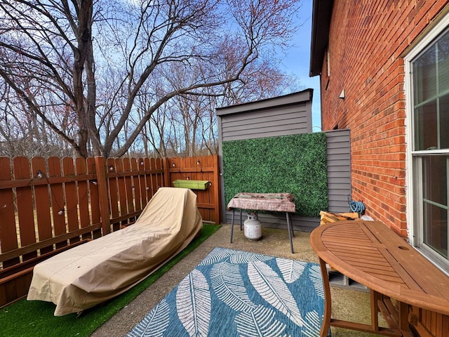 view of patio / terrace featuring fence