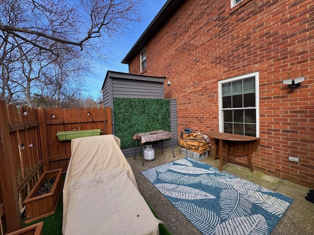 view of patio featuring fence